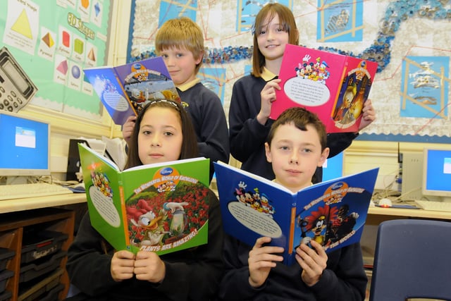 These pupils were having a great time as they read Disney books in 2011. Pictured back from left are Matthew Rawlings and Olivia Foster. Front from left Alix Wagner and Thomas Harding.