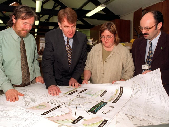 Looking at action plans for the rejuvenation of Allerton Bywater at Groundwork Leeds headquarters in Morley are, from left, John Cummins, Groundwork Lower Aire Valley Project Officer, Colin Burgon, MP Elmet, Mary Anne Tupling, principal landscape architect for Groundwork Leeds and Paul Woods, business development manager for Groundwork Leeds. Pictured in May 1997.
