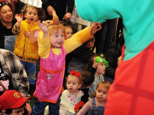 Three-year-old Isabelle Harrington of Bramley reaches out to the characters