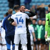 LINEAGE: From Leeds United's owners to boss Daniel Farke, back, to his Whites players. Farke is pictured with Joe Rodon and Illan Meslier after September's 3-0 victory at Millwall. Picture by George Tewkesbury/PA Wire.