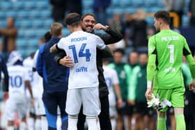 LINEAGE: From Leeds United's owners to boss Daniel Farke, back, to his Whites players. Farke is pictured with Joe Rodon and Illan Meslier after September's 3-0 victory at Millwall. Picture by George Tewkesbury/PA Wire.
