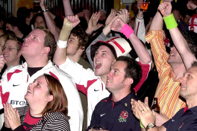 England and Australian fans pictured at the Walkabout Bar, Leeds, in readiness for the Rugby World Cup Final, pictured on Saturday, November 22, 2003, England fans celebrating.