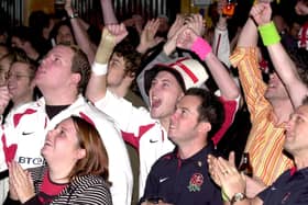 England and Australian fans pictured at the Walkabout Bar, Leeds, in readiness for the Rugby World Cup Final, pictured on Saturday, November 22, 2003, England fans celebrating.