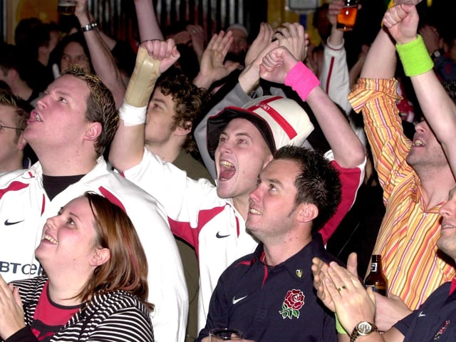 England and Australian fans pictured at the Walkabout Bar, Leeds, in readiness for the Rugby World Cup Final, pictured on Saturday, November 22, 2003, England fans celebrating.