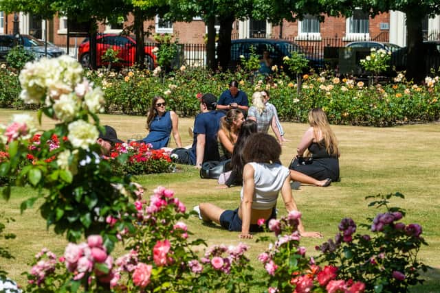 Office workers in Park Square, Leeds, enjoying the warm weather during the July extreme heatwave.
