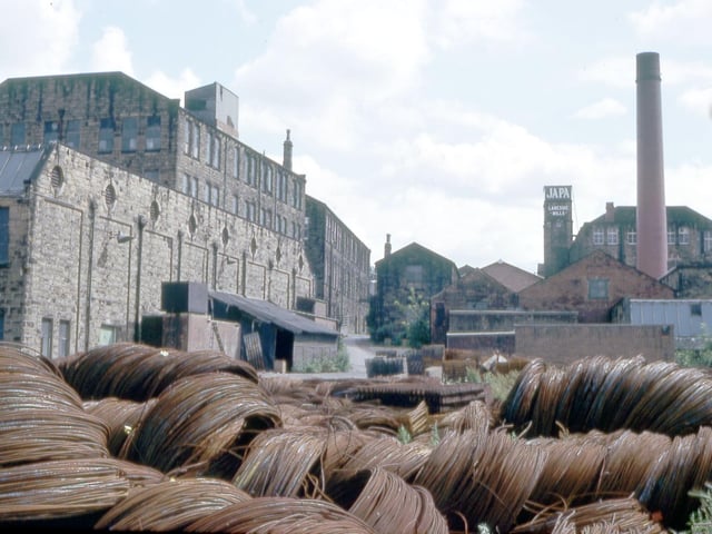 The Japa factory located at Laneside Mills since 1936. They manufactured a variety of paper products before closure circa 1994. Prior to 1936 the mills had been occupied by the textile manufacturing firm of Charles Scarth, the largest in the Morley area. The oldest part of the mills dated from 1829 when George Crowther started his textiles business. Coils of wire are stacked in the foreground.
