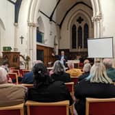 Coun James Lewis, leader of Leeds City Council, addressing residents about proposed battery farms at St Mary The Less Church in Allerton Bywater, Leeds, this week.