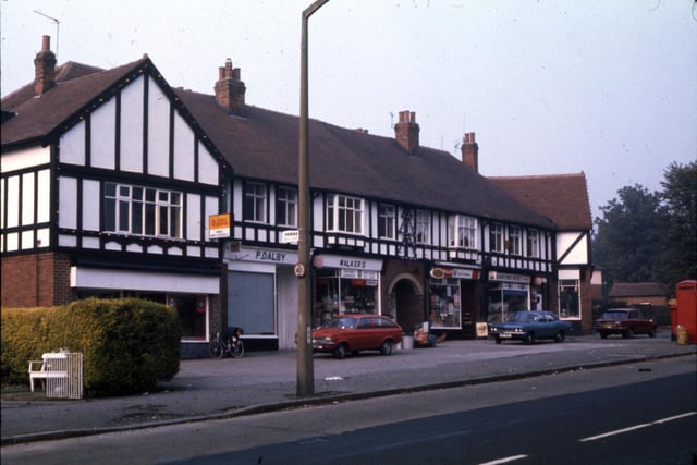 A parade of shops on Stonegate Road between Parkland Crescent and Parkland Drive.  Shops include P. Dalby, Walker’s, Spar and a Post Office.