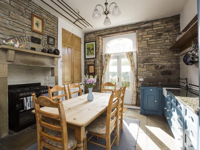 There's chimney breast space for a range cooker in the kitchen, that has wooden units with granite worktops.