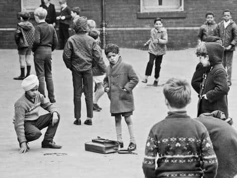 The image shows children playing in the playground of Queen's Road County Primary School, Hyde Park, in 1969. It was taken by photographer Eric Jaquier. The school's named was changed to Royal Park Middle School in around 1972, and it later closed altogether in 2004.
Picture: Leeds Libraries, www.leodis.net.