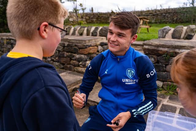 Leeds United star Jamie Shackleton was kept busy signing autographs on a recent trip to Lineham Farm, in Eccup, where Leeds Children's Charity has its base. It came as the club announced its partnership with the charity for the 2023/24 season. Photo: DANNYRICH.co.