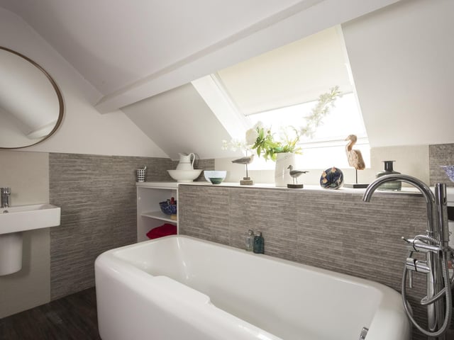 The house has three bathrooms, one being an en suite to the principal bedroom.