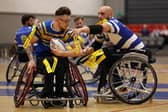 Rhinos' Josh Butler in action against Halifax Panthers' Jeremy Boursin earlier this season. Picture by John Clifton/SWpix.com.