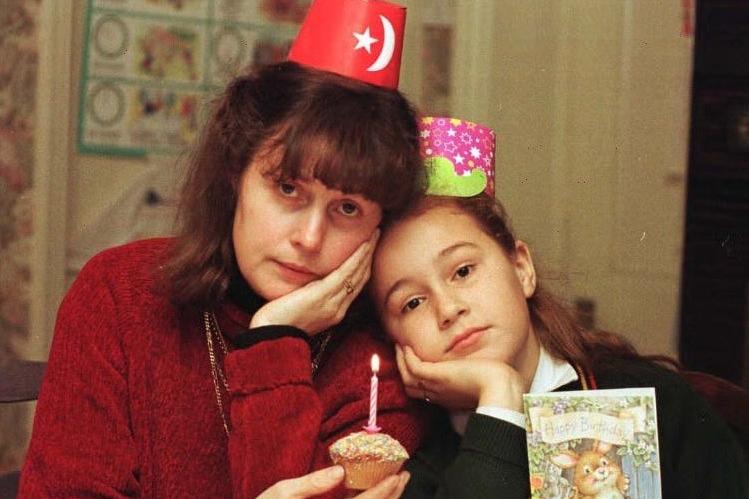 It wasn't a very happy birthday for Julie Wray pictured with her daughter Amy. She was celebrating without her trucker husband Dave at their home in Tingley. He was stuck near Calais in the French drivers strike which may well bankrupt them. Pictured in November 1996.