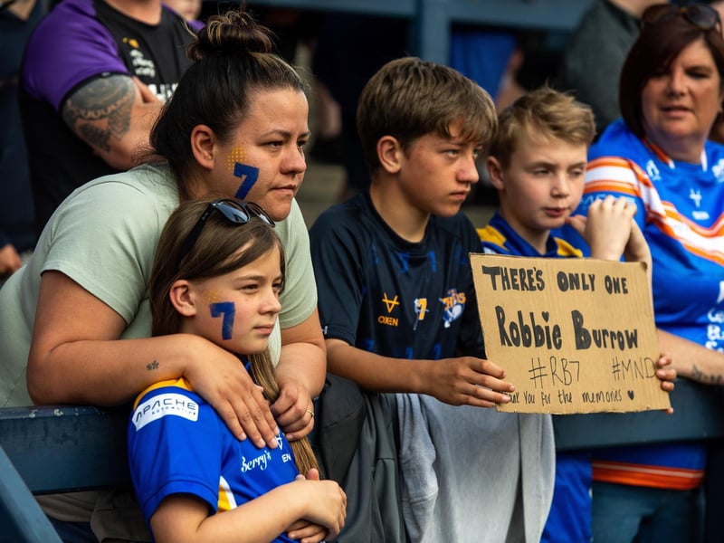 Leeds Rhinos fans with a special message at the game agianst Leigh Leopards on golbal MND awareness day.
