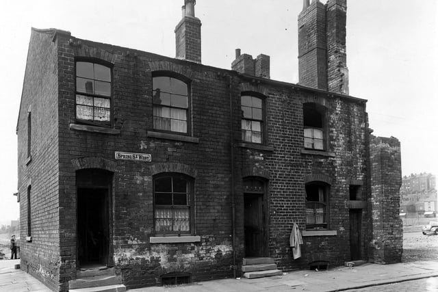 Two of the last remaining properties on the odd numbered side of Spring Street West in July 1950.