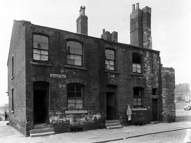 Two of the last remaining properties on the odd numbered side of Spring Street West in July 1950.