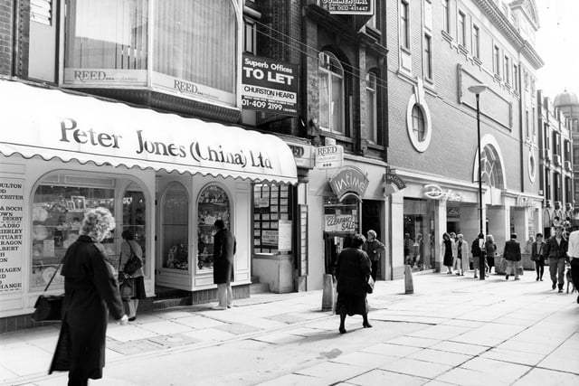 The east side of Lands Lane in Apirl 1989. Shops in focus are from left, Peter Jones China, with Reed employment agency above, In time jewellers, Dolcis footwear and Miss Selfridge ladieswear. Offices above the shops are advertised as being to let.