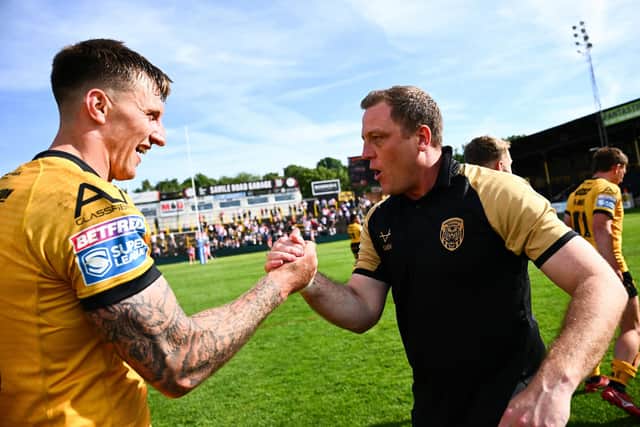 Castleford Tigers coach Ryan Carr, right, celebrates with forward Alex Mellor following the win against St Helens two weeks ago. Picture by Olly Hassell/SWpix.com.