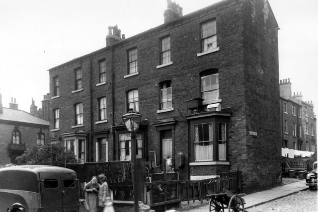 On the left is Stratton Street, then three houses on Tonbridge Place. Number 7 is on the left, 9 in the middle and 11 on the right. Finsbury Street can be seen on the right. Pictured in September 1960.