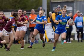 Bethan Dainton makes a break during Leeds Rhinos' win over Huddersfield Giants in this season's Betfred Women's Challenge Cup. Picture by John Victor.