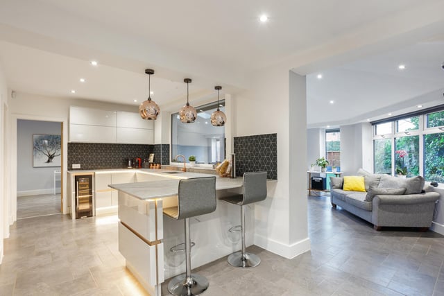 The ground floor is arranged in an open and sociable design with a fabulous kitchen and dining area featuring a number of integrated appliances including a wine cooler, mood lighting and a roof lantern providing excellent natural light.
