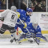 UNDER PRESSURE_ Leeds Knights' goalie Sam Gospel freezes the puck against Hull Seahawks under pressure from former team-mate, Ethan Hehir.