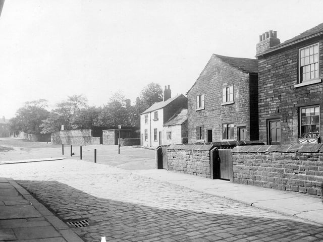 Woodhouse Cliff from close to the junction with Ebury Street in June 1913. The series of high walls seen in the background enclose the gardens of large villas, firstly, Sycamore Lodge, then Cavendish Villas. Just beyond the pavement in the foreground, left, is the junction with Fulneck Street. In the background, left, a row of houses in Cliff Road is visible.