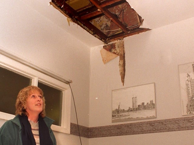 Headteacher Barbara Giles looks at flood damage at Lower Wortley Primary School in January 1996.