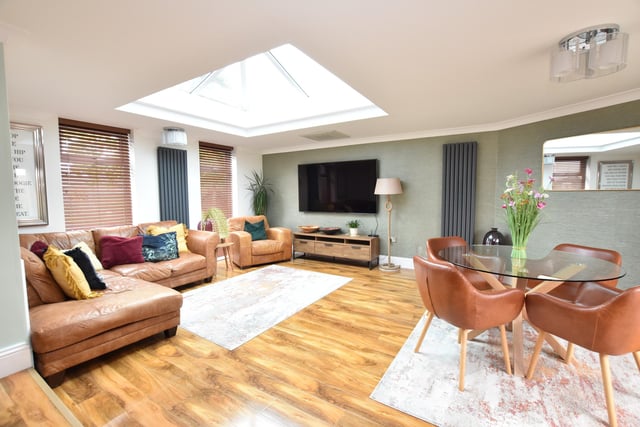 The kitchen has a square arch and steps down to the stunning living room which has two windows to the front and French doors to the rear. This welcoming room also has a large ceiling lantern light window which gives a lovely contemporary feel.