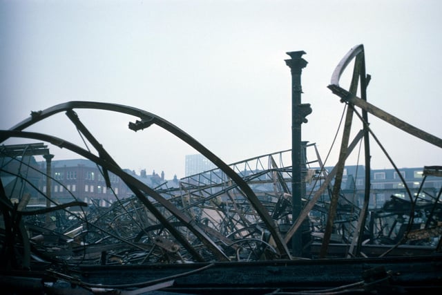 The damaged remains of Kirkgate Market following a massive fire which spread through the building in December 1975, destroying two thirds of it. Most of the 1857 section of the market was completely gutted but firefighters managed to save the 1904 frontage onto Vicar Lane and Butchers' Row.