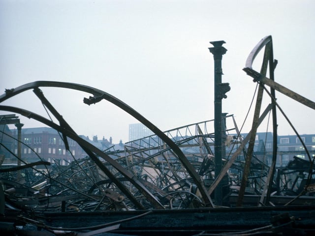 The damaged remains of Kirkgate Market following a massive fire which spread through the building in December 1975, destroying two thirds of it. Most of the 1857 section of the market was completely gutted but firefighters managed to save the 1904 frontage onto Vicar Lane and Butchers' Row.