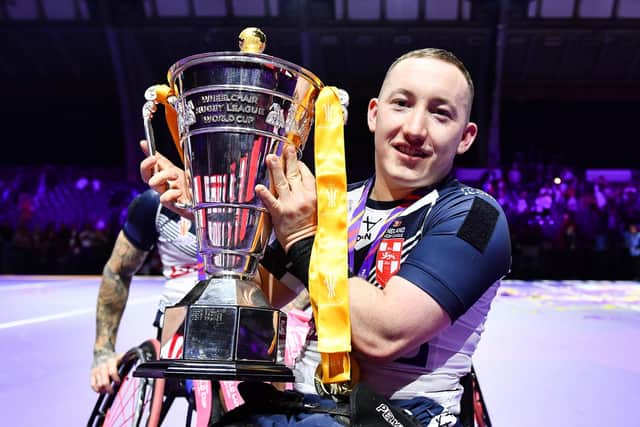 Leeds Rhinos' Nathan Collins with the Wheelchair Rugby League World Cup after England's win against France four years ago. Picture by Will Palmer/SWpix.com.