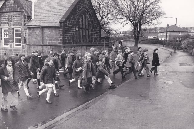 Pupils from St Margaret's crossing the road to go from the main school to the classrooms, about 100 yards up the road in November 1973. They had to cross the road at least four times a day. They were taught physical education and drama in the main school, as the classrooms were too small.