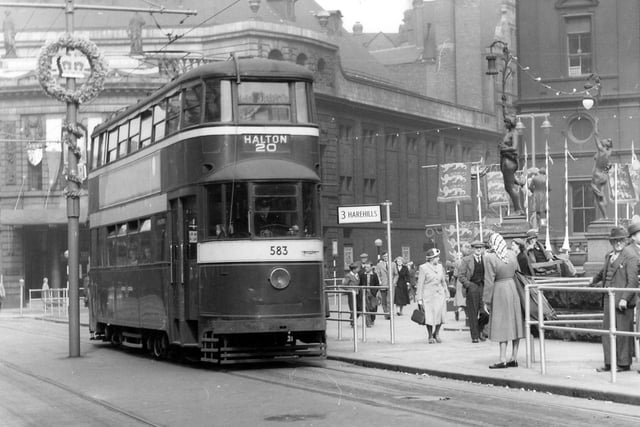 Decorations are still in evidence following the coronation four days earlier. The view shows ex-London tram no.583 stopping in City Square on its way to Halton via route 20. In the background on the left is the Majestic Cinema, then the junction with Quebec Street, and the General Post Office on the right.