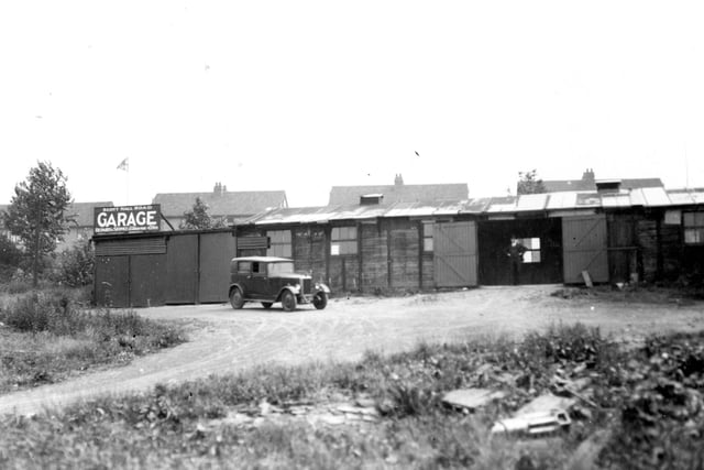 Scott Hall Road, the business premises of Hubert Coates, proprieter of Scott Hall Garage. Pictured in July 1937.