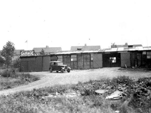 Scott Hall Road, the business premises of Hubert Coates, proprieter of Scott Hall Garage. Pictured in July 1937.