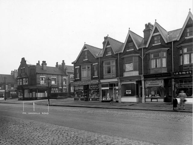 Harehills Road in September 1950.View of numbers 131 to 143  looking north east along the east side. At the far left is Ashton Grove then shop numbers 131, S. Hartshorne, Confectioner and number 133, A. Lyon, Milliner. Next is Ashton Place followed by a parade of shops numbered as 135 to 143 Harehills Road. Number 135 is J.C. Richmond, Chemist, 137 is Turner and Fishburn, Drapers. Number 139 is empty and number 141 is Leicester Shoe Repairs. Finally at number 143 there is F. and C. Eamonson, Butchers. 