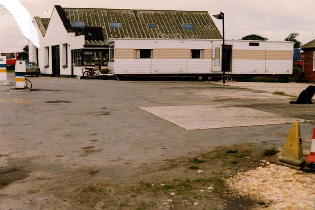 A mobile home outside Tadcaster Way Service Station, proposed to be turned into a cafe. The service station building is in the background with petrol pumps on the left. Pictured in September 1980.
