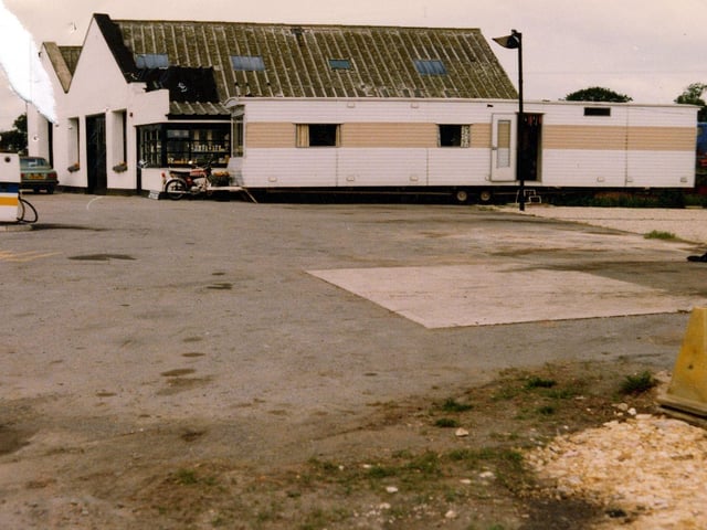 A mobile home outside Tadcaster Way Service Station, proposed to be turned into a cafe. The service station building is in the background with petrol pumps on the left. Pictured in September 1980.