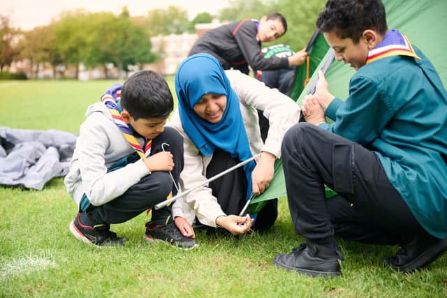Scouts putting up a tent