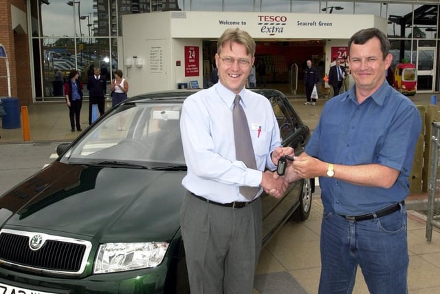 Competition winner Gary Marshall, who is handed the keys to his new Skoda by Tesco manager Rob Lane, in Seacroft, Leeds, in 2001.