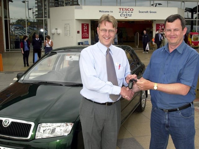 Competition winner Gary Marshall, who is handed the keys to his new Skoda by Tesco manager Rob Lane, in Seacroft, Leeds, in 2001.