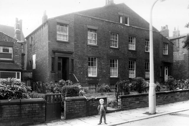 Springfield Place in July 1960. Development of this street had begun in 1831, most buildings were completed by 1839. It was the second phase of building in the Little Woodhouse area. The small boy in view perhaps lived locally as he appears in other photos.