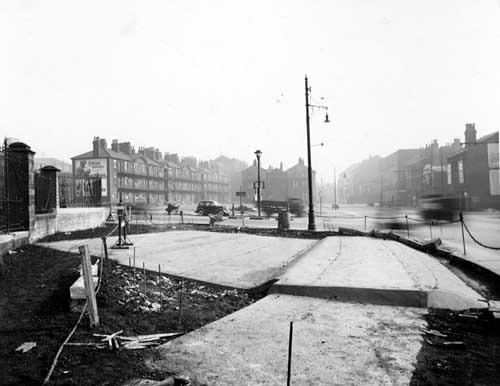 Marsh Lane and Duke Street in March 1939. Beck covering work in foreground. In the background can be seen Marsh Lane tenements. To the left are wrought iron railings.