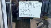 This sign is visible in the Beer Hawk window.