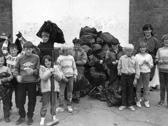 Children of South Gipton take part in a clean-up campaign on the estate. It was a project instigated by the Gipton Community Refurbishment Scheme and the children were involved as part of a holiday play project. The children filled more than 60 sacks with rubbish and were provided with refreshments by sponsors, Kentucky Fried Chicken. The youngsters were hoping to win a prize in the National Clean-up competition organised by the Keep Britain Tidy Campaign. Pictured in November 1987.