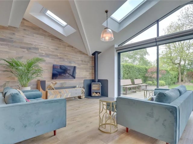There's a cast iron wood burning stove in the living area and a Sonos music system. There is also a separate Alexa-controlled Smart home system that controls the blinds, which is integrated with the Sonos music system.