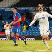 Patrick Bamford of Leeds United celebrates after scoring their team's second goal during the Premier League match between Leeds United and Crystal Palace at Elland Road on February 8, 2021.