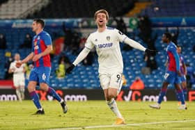 Patrick Bamford of Leeds United celebrates after scoring their team's second goal during the Premier League match between Leeds United and Crystal Palace at Elland Road on February 8, 2021.